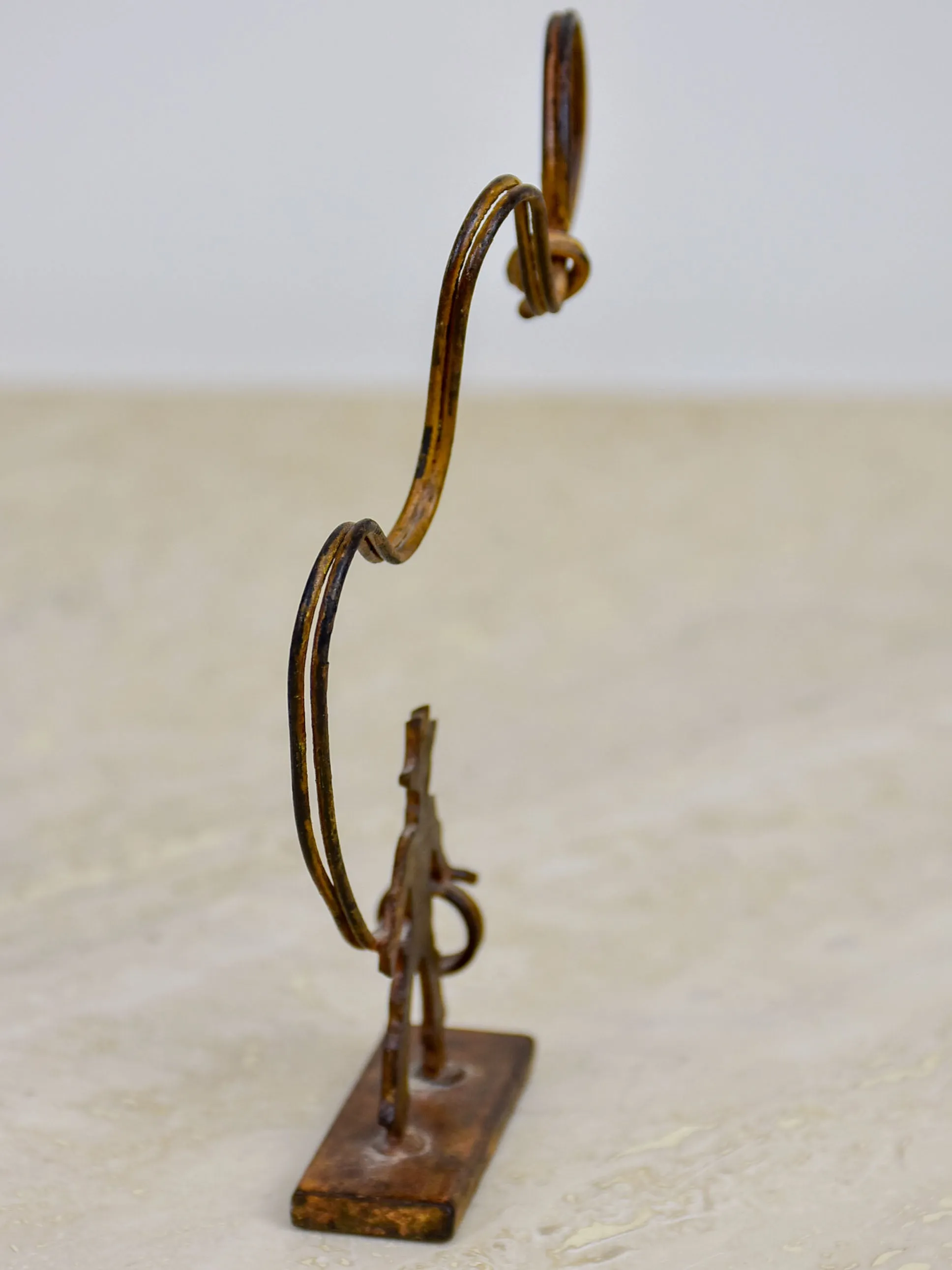 Antique cowboy lasso sculpture